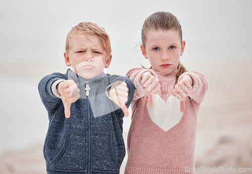 Image of Sad children portrait, hands thumbs down or outdoor with news of negative Ukraine problem to protest war. White siblings vote no, angry emoji in cold winter and sign language rejection gesture