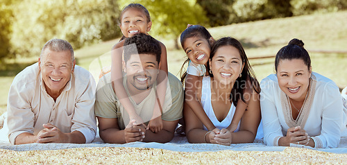 Image of Relax, nature and big family on a happy picnic to enjoy quality time, bonding and summer holidays vacation. Grandparents, mother and father with children siblings smile together in a group portrait