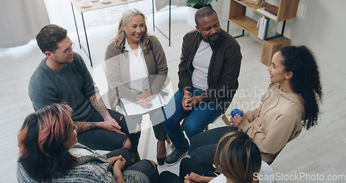Image of Team building, therapy group and people in circle for mental health support, communication and counseling service in office. Diversity, community and trust group of people in psychology talk together