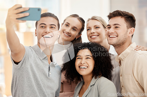 Image of Diversity work, happy group selfie with phone in office for solidarity or team building in marketing startup. Multicultural team smile, smartphone photo together or workplace happiness community