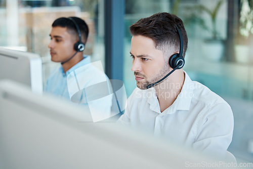 Image of Call center, focused businessman and helping with customer service advice online. Operator, telemarketing and consultant offering digital support using a headset. Hotline agent, contact us and help