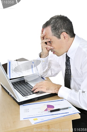 Image of Businessman at his desk on white background