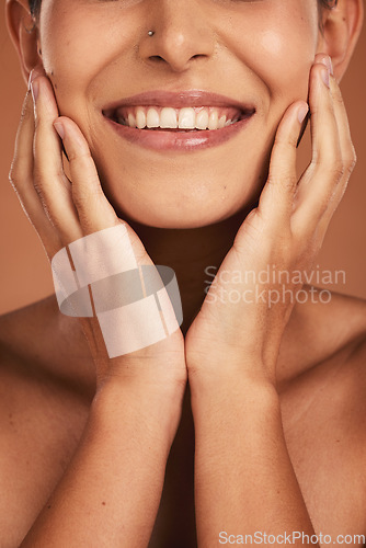 Image of Dental, oral care and closeup of woman teeth with whitening, hygiene and health in a studio. Happy, smile and girl model with a natural, clean and healthy mouth isolated by a brown background.