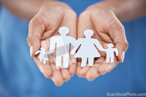 Image of Hands, paper and advertising for family insurance, support and trust with charity, values or community. Woman hand for marketing kindness, family cutout of people with planning life for future