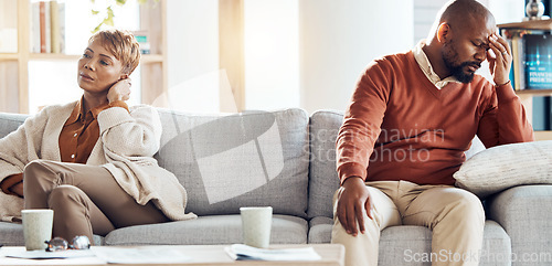 Image of Fight, divorce and sad with old couple on sofa for problem marriage, mental health and difficult. Conflict, depression and mental health with old man and woman in living room for depression and angry