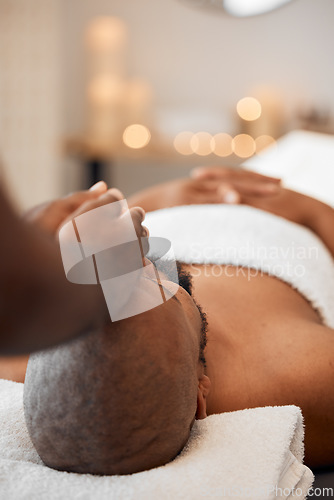 Image of Black man, head massage or relax spa in relax hotel, wellness salon or luxury resort for self care, mental health or peace. Massage therapist, hands and zen aromatherapy for healthy stress management