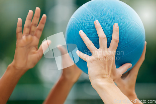 Image of Netball, sport and athlete hands with ball, game and challenge on a court in urban city park outside. Women, sports fitness and healthy lifestyle wellness training outdoor during training or practice