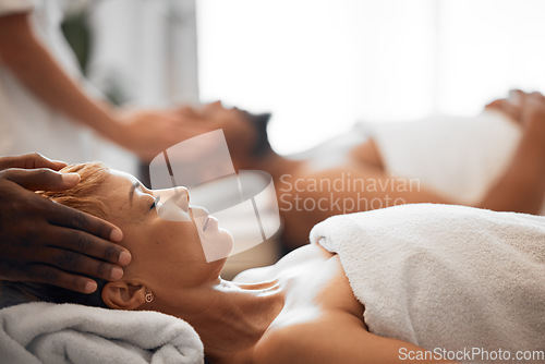 Image of Woman, head massage or couple spa in relax wellness hotel or salon for romantic holiday, break or bonding date. Massage therapist, hands and reiki for headache, stress management or luxury healthcare