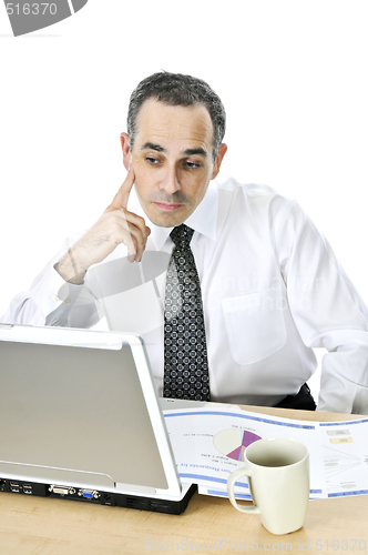 Image of Businessman at his desk on white background