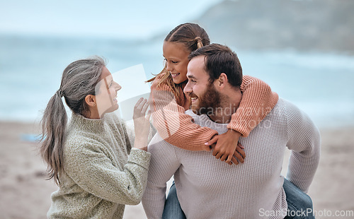 Image of Family, love and piggy back at beach on holiday, vacation or trip. Support, care and grandma with father carrying girl outdoors, enjoying quality time together having fun or bonding by sandy seashore