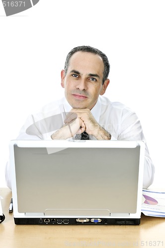 Image of Businessman at his desk on white background