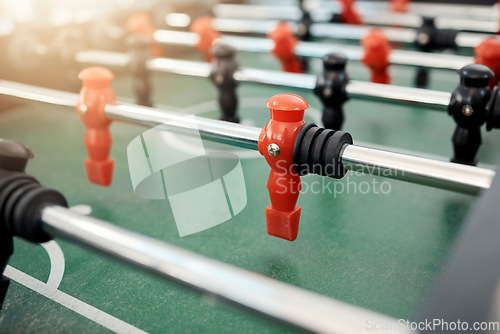 Image of Foosball, game and table for entertainment, fun and team activity with artificial toy or players in zoom. Plastic, arcade and games for competition, competitive and miniature football or soccer field