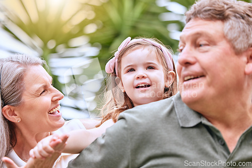 Image of Summer, fun and grandparents with girl in the park enjoying weekend, holiday and quality time. Family, love and child playing in garden with grandma and grandfather bonding and having fun in nature