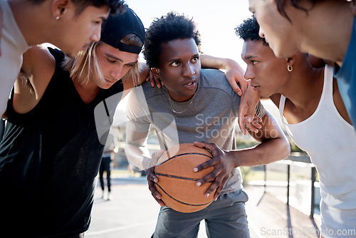 Image of Basketball, team and huddle on basketball court in trust circle for motivation, planning and game strategy. Fitness, friends and basketball players share sport goal, mission and support while talking