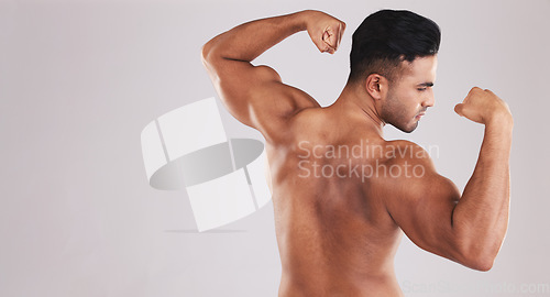 Image of Muscle, strong and man flexing arms with training progress against grey mockup studio background. Fitness, wellness and back of athlete bodybuilder with power and bicep from exercise and workout