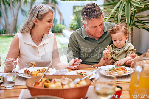 Image of Family, dinner and eating food at restaurant together smile and happy grandparents bonding with child. Elderly couple, healthy leisure lifestyle and wellness teaching or feeding kid vegetable stew.