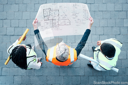 Image of Architect, team and construction blueprint above for building, planning or structure layout to work on site. Business people in architecture with industrial floor plan in teamwork for company project