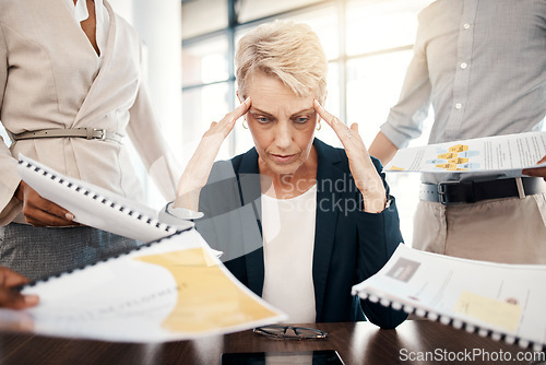 Image of Business woman, stress, burnout and documents with staff question, management and frustrated with work load. Mature manager with mental health, tired and headache while working with finance paperwork