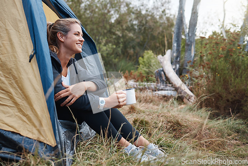 Image of Camp, woman and coffee in tent, smile and outdoor to enjoy nature, freedom and fresh air. Female, girl and camping drink tea in morning, at campsite and happy with wellness, healthy and natural view.
