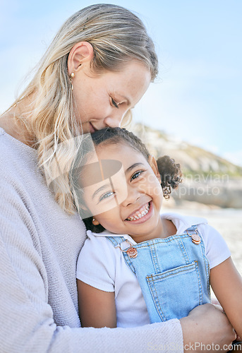 Image of Mom, adopted girl and love at beach together in summer sun on a family vacation, smile with happiness and enjoy bonding together. Child with a smile, happy mom and affection on Costa Rica holiday