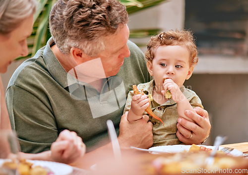 Image of Family, lunch and grandparents have food with child at home for happy bonding meal together. Senior grandmother, grandpa and young kid at family home eating at dining table in summer.