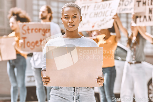 Image of Protest, sign and mockup with a black woman activist holding cardboard during a rally or demonstration. Poster, freedom and politics with a young female fighting for human rights or equality