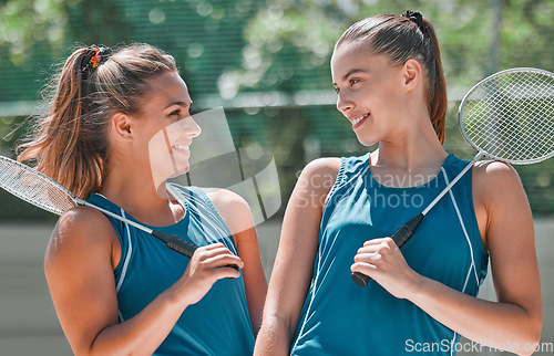 Image of Teamwork, sports and badminton with women on court for training, summer and workout. Games, match and competition with girl badminton player for cardio, endurance and friends lifestyle together