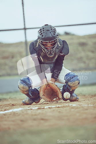 Image of Baseball, sports and ball with a catcher on a grass pitch or field during a game or match outdoor. Fitness, exercise and catch with a male baseball player playing a competitive sport outside