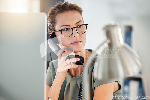 Image of Telephone, phone call and business woman in office, talking and thinking. Landline, communication and female employee from Canada on call speaking, chatting or work discussion in company workplace.