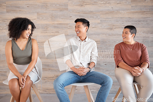 Image of Diversity, people and sitting on chair in queue, excited job interview or recruitment meeting, communication and conversation of employee engagement. Happy group in waiting room of hiring opportunity