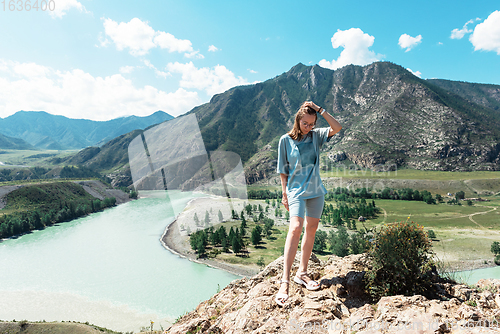 Image of woman on the confluence of two rivers Katun and Chuya in Altai mountains, beauty summer day