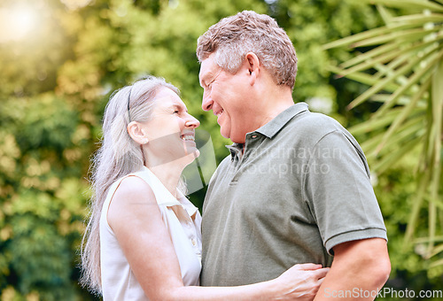 Image of Senior couple hug, retirement and happy, love and care in nature, travel and adventure with holiday and enjoy being retired. Elderly, man and woman smile together, outdoor fun and leisure lifestyle.