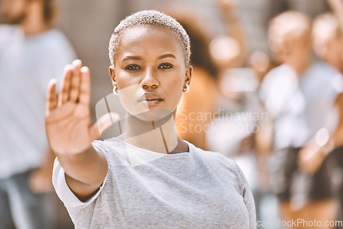 Image of Stop, protest and hand of black woman in city for activism, social justice or empowerment. Justice, freedom and support with girl no or caution sign for global change, human rights or gender equality