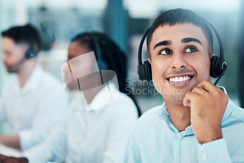 Image of Happy, call center and man on break thinking of crm solution or contact us strategy with excited look in office. Indian telemarketing person in professional workspace thoughtful with idea.