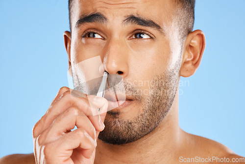 Image of Man, nose grooming and facial care beauty wellness treatment blue background in studio. Portrait of young male face, cosmetic body skincare healthy lifestyle and hand nasal hygiene personal care