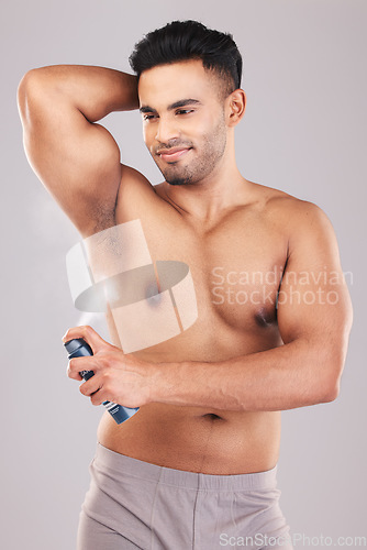 Image of Man, armpit hygiene and body skincare perfume for healthy lifestyle grooming. Happy person, clean natural wellness and underarm dermatology deodorant spray treatment after shower in studio background