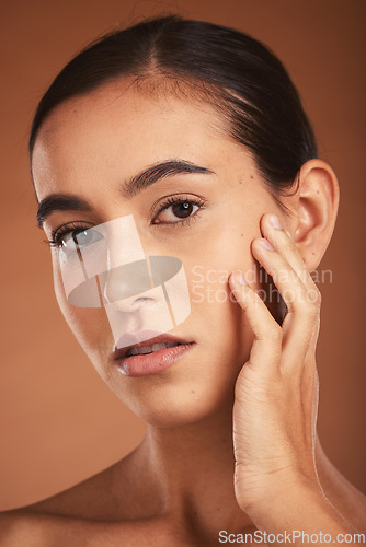 Image of Skincare, young girl and face with cosmetics, confident and healthy organic facial with brown studio background. Portrait, makeup and girl with pride, natural beauty for smooth skin and wellness.