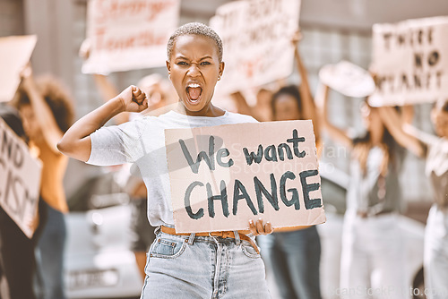 Image of Woman, angry protest and banner in city street for freedom, peace and social diversity. Young black girl, people walk in protesting rally together and community collaboration for feminist empowerment