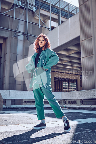 Image of Urban, fashion and woman with street clothes for travel, lifestyle and comfort in the city of Seoul for holiday. Young, stylish and portrait of a young trendy fashion model with designer clothing