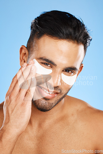 Image of Man, eye care and cotton patch for skincare, organic facial or wellness for health, body care or clear skin. Portrait, Indian male or natural beauty for anti wrinkle, remove dark circles or face glow