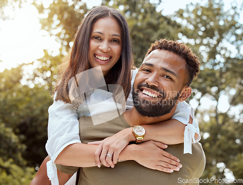 Image of Love, black couple and with smile hug, bonding and happy together outdoor for fun, loving and embrace. Portrait, romance and man piggy back woman with happiness, marriage, relationship and celebrate.