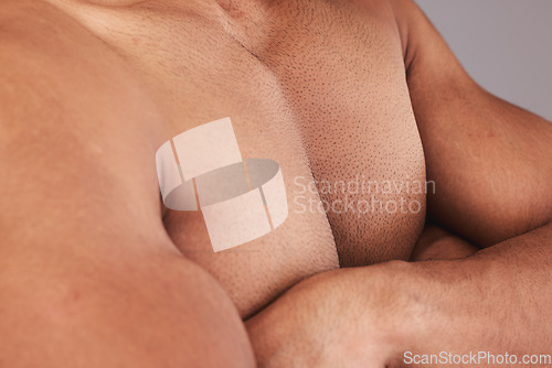 Image of Chest, man body and bodybuilder with crossed arms being bare, confident and flex biceps. Closeup, health male and muscular trainer, fitness and show pecs after workout, gym session and powerful.