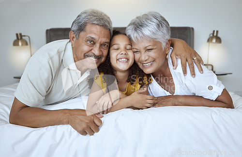 Image of Love, bonding and mature people with child bonding while relaxing on the bed at home. Grandmother, grandfather and grandchild resting with affection and bond in their house bedroom for loving oomfort