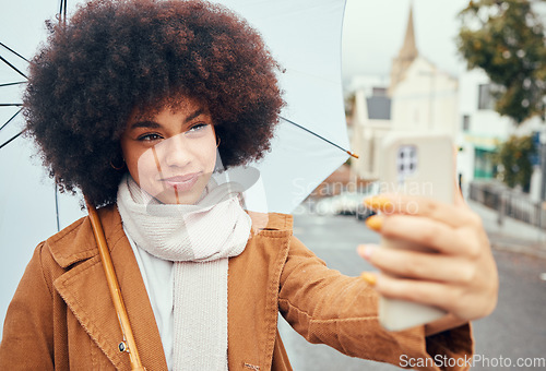 Image of Travel, woman or phone selfie with umbrella in New York city on social media review, video call or live streaming on content creator vlog. Happy, smile or afro influencer on vlogger mobile technology