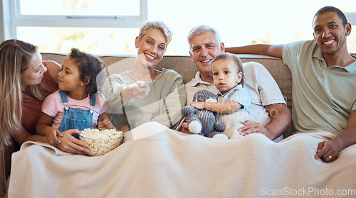 Image of Happy family on sofa watching tv with popcorn and kids show, film or comedy movie on live streaming service. Television, relax and grandparents with children on couch with love, diversity and talking