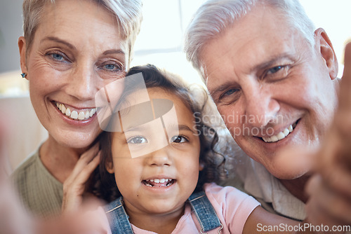 Image of Interracial family, selfie and girl with grandparents at home feeling happy with love and care. Portrait of senior people with an adopted kid bonding together at a house busy with youth care