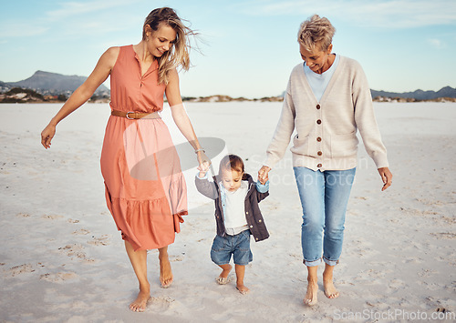 Image of Beach, mother and grandma with boy holding hands having fun, bonding and walking. Family, care and grandmother, mom and kid or child enjoying holiday time together outdoors on sandy seashore or coast