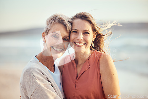 Image of Beach, hug and elderly mother and daughter relax, bond and enjoy quality time freedom, peace or travel vacation. Mamas love, nature wind and happy family portrait of women on Toronto Canada holiday