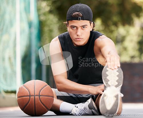 Image of Portrait, basketball and man stretching legs for flexibility, wellness or mobility. Sports, fitness and basketball player on basketball court ready for training, exercise or workout, match or game.