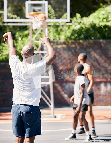 Image of Basketball player, score and point in sports game for goal, victory or winning throw at the court outdoors. Man in basketball sport playing, scoring and perfect long shot for match outside